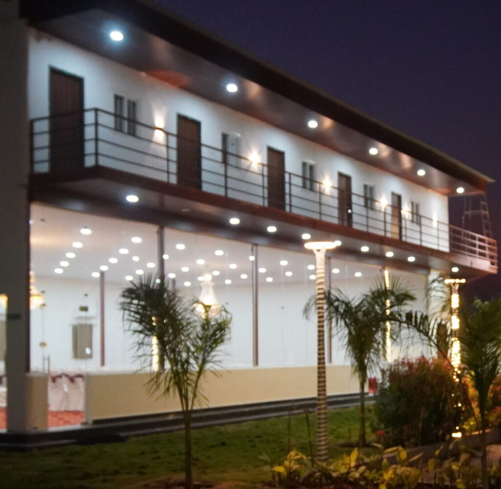 Premium farm house for 40 people in Hyderabad featuring multiple guest rooms and a large banquet area for group celebrations.